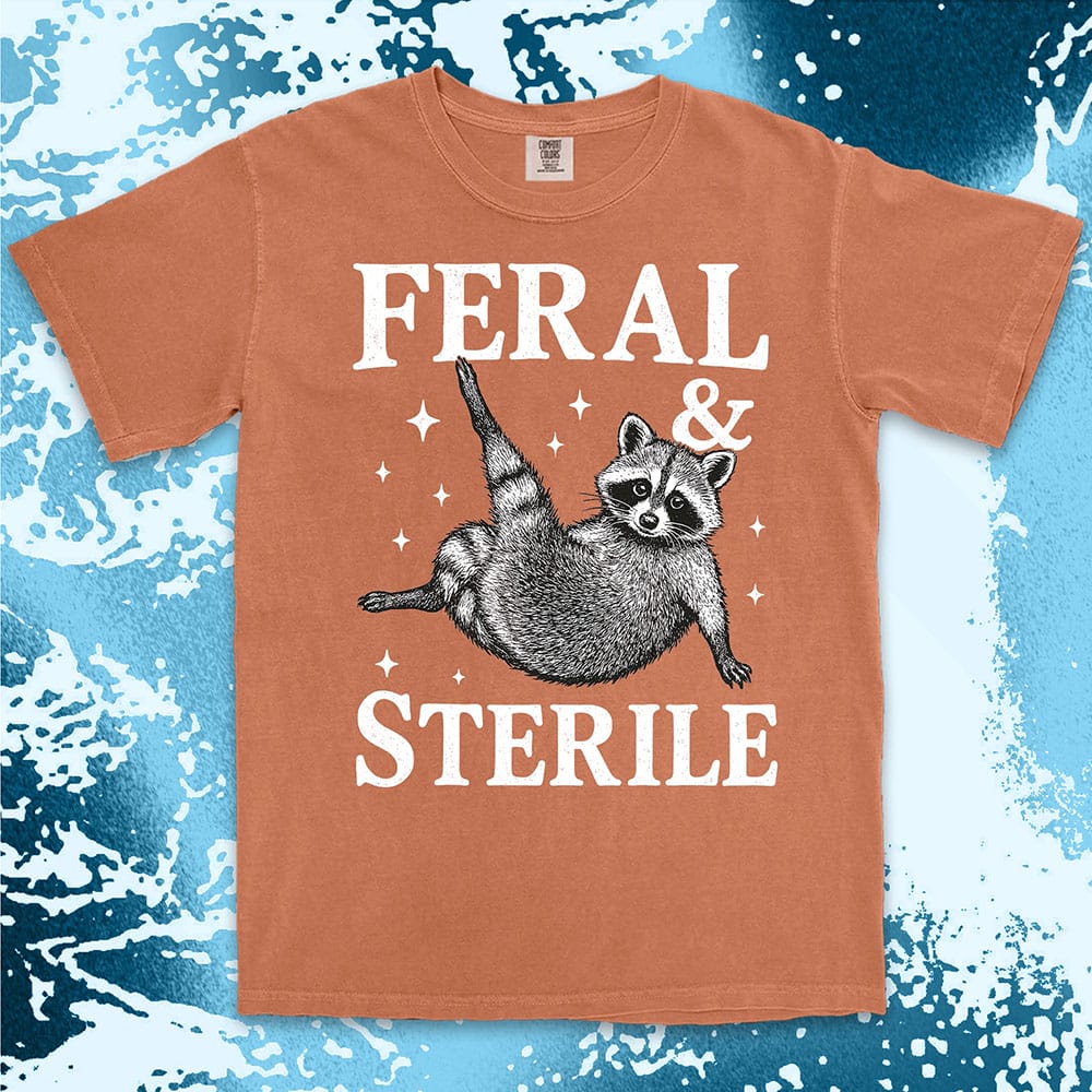 feral and sterile raccoon lying on back comfort colors t-shirt