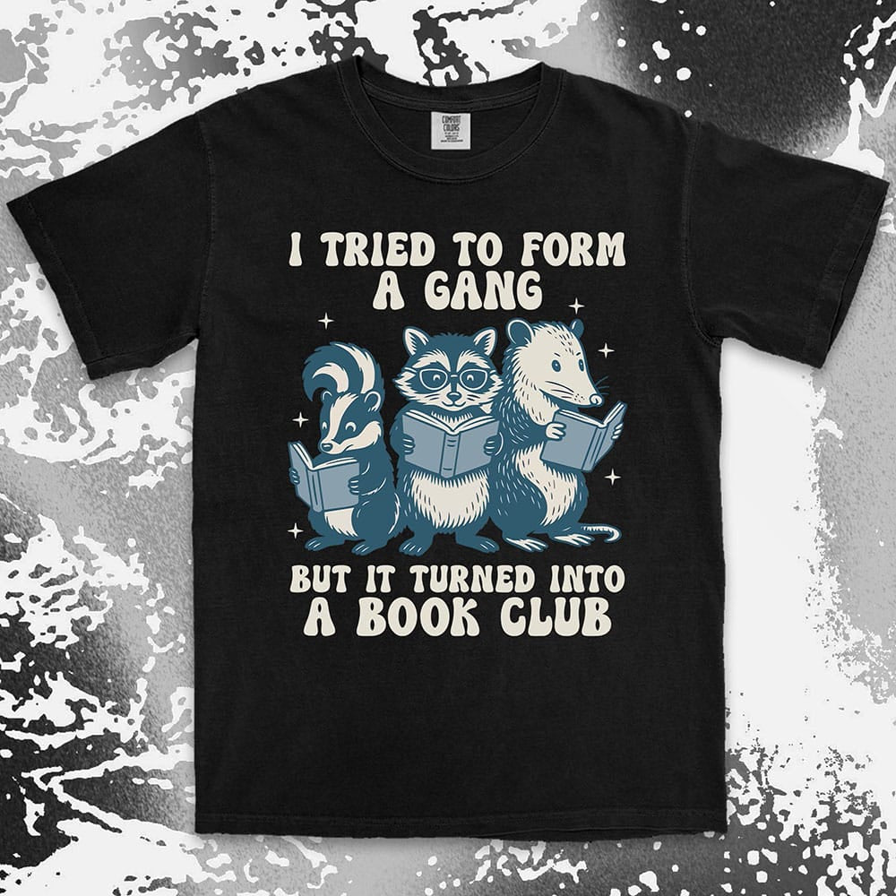 Comfort Color t-shirt with raccoon, skunk, and possum reading books and quote “I tried to form a gang but it turned into a book club.”