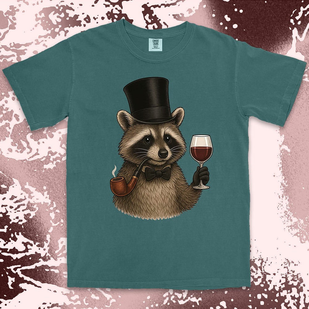 Raccoon shirt featuring a gentleman raccoon in top hat and bow tie, holding a glass of wine and smoking a pipe, on Comfort Color t-shirt.