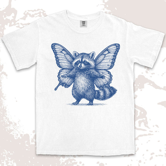 Comfort Color t-shirt with raccoon illustration featuring big butterfly wings in a magical fairy style.