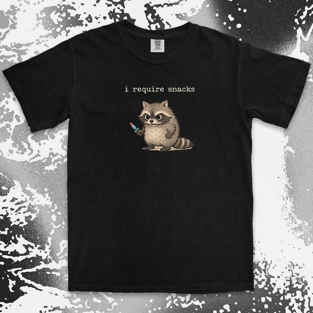 Cute raccoon shirt with ÒI require snacksÓ quote, chubby raccoon holding a small knife. Comfort Color t-shirt.
