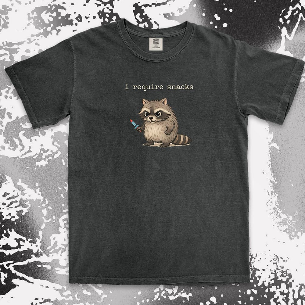 Cute raccoon shirt with ÒI require snacksÓ quote, chubby raccoon holding a small knife. Comfort Color t-shirt.