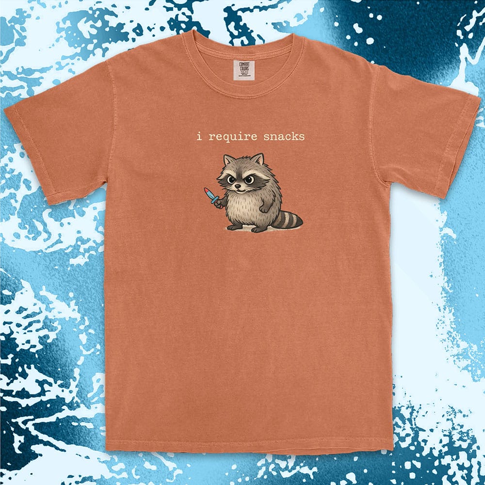 Cute raccoon shirt with ÒI require snacksÓ quote, chubby raccoon holding a small knife. Comfort Color t-shirt.