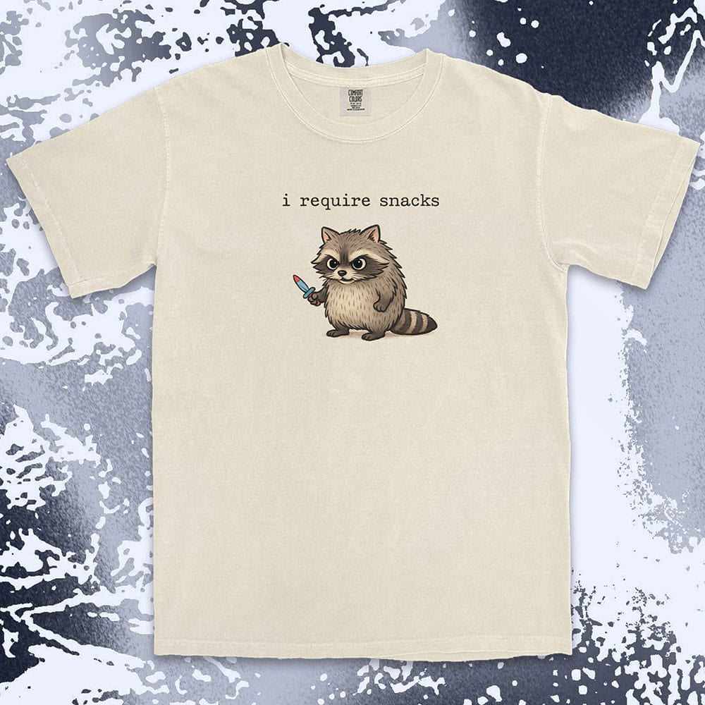Cute raccoon shirt with ÒI require snacksÓ quote, chubby raccoon holding a small knife. Comfort Color t-shirt.