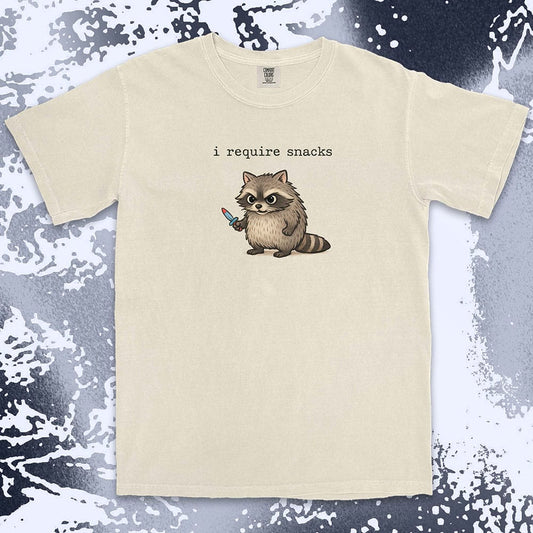 Cute raccoon shirt with ÒI require snacksÓ quote, chubby raccoon holding a small knife. Comfort Color t-shirt.