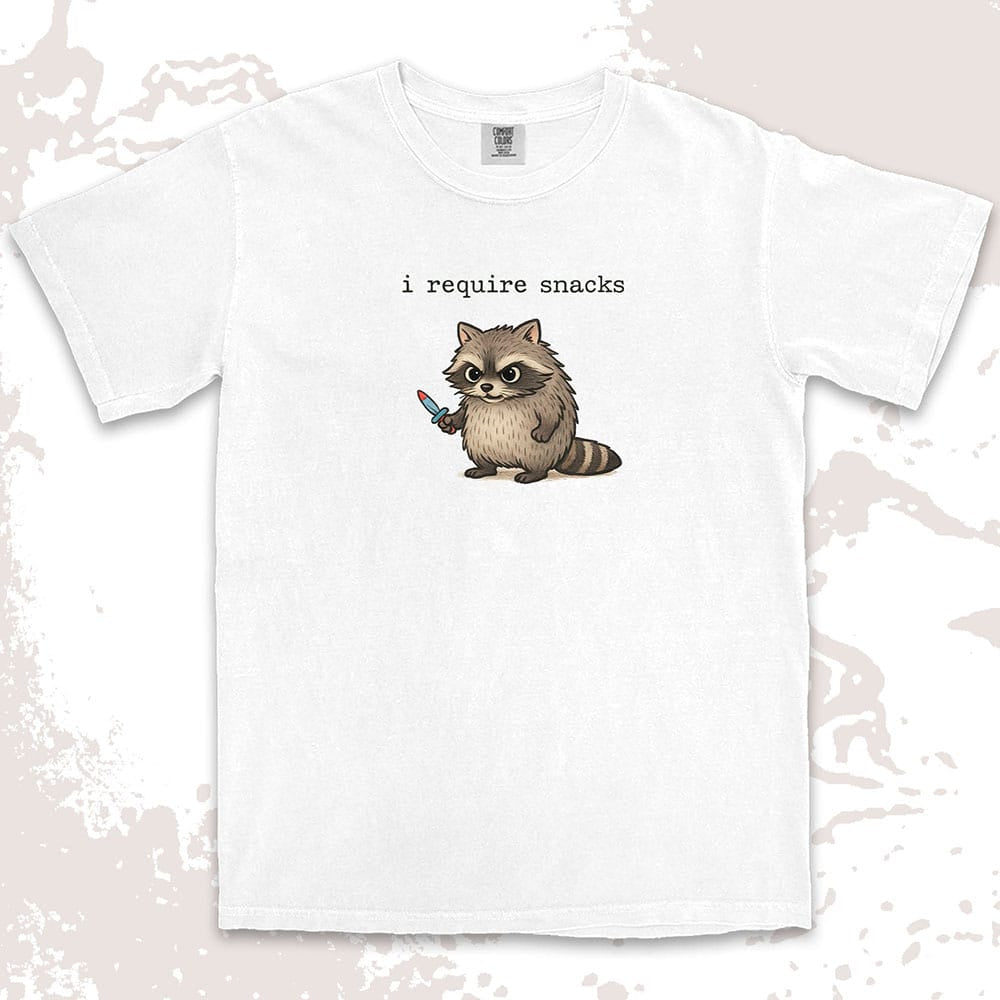 Cute raccoon shirt with ÒI require snacksÓ quote, chubby raccoon holding a small knife. Comfort Color t-shirt.