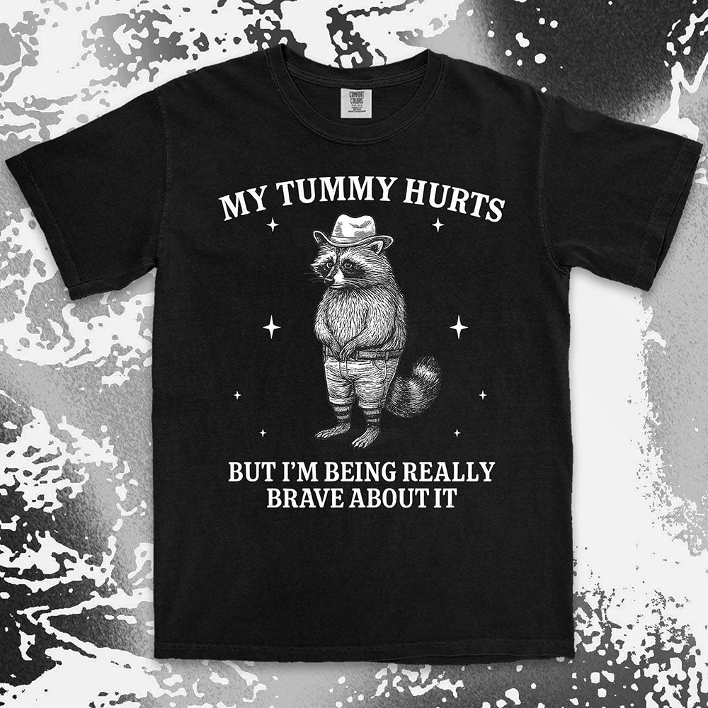 Funny raccoon shirt with “My Tummy Hurts But I’m Being Really Brave About It” quote, cowboy hat animal design