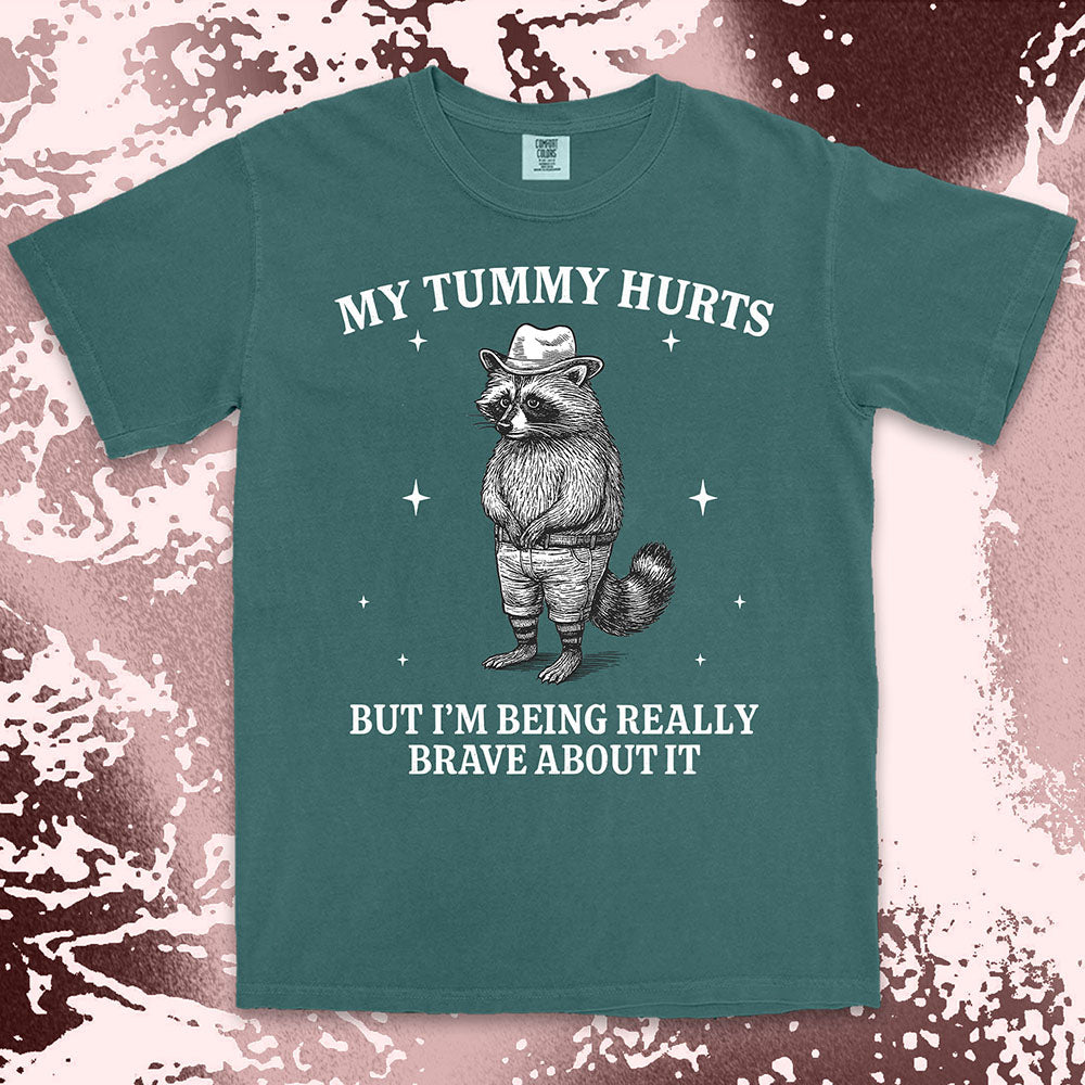 Funny raccoon shirt with “My Tummy Hurts But I’m Being Really Brave About It” quote, cowboy hat animal design