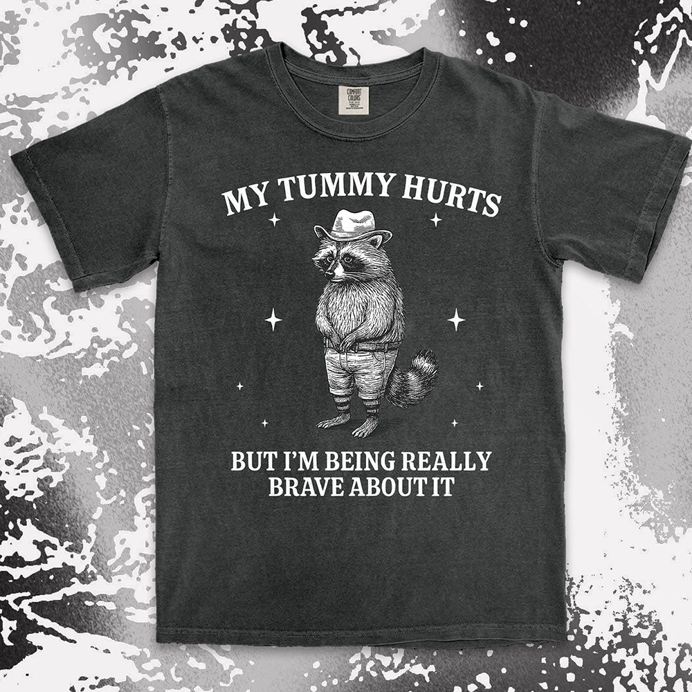 Funny raccoon shirt with “My Tummy Hurts But I’m Being Really Brave About It” quote, cowboy hat animal design