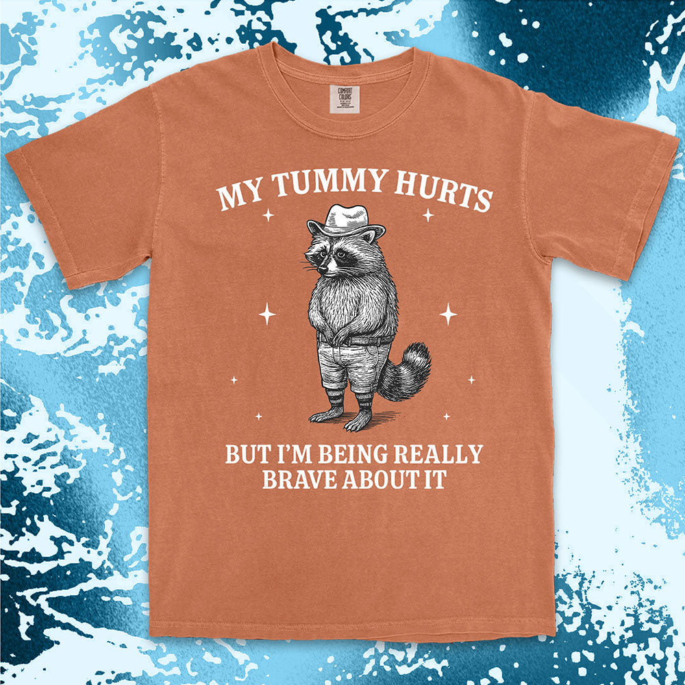 Funny raccoon shirt with “My Tummy Hurts But I’m Being Really Brave About It” quote, cowboy hat animal design