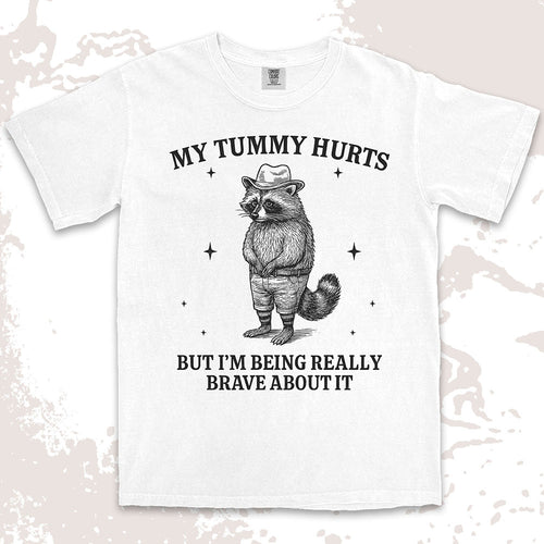 Funny raccoon shirt with “My Tummy Hurts But I’m Being Really Brave About It” quote, cowboy hat animal design