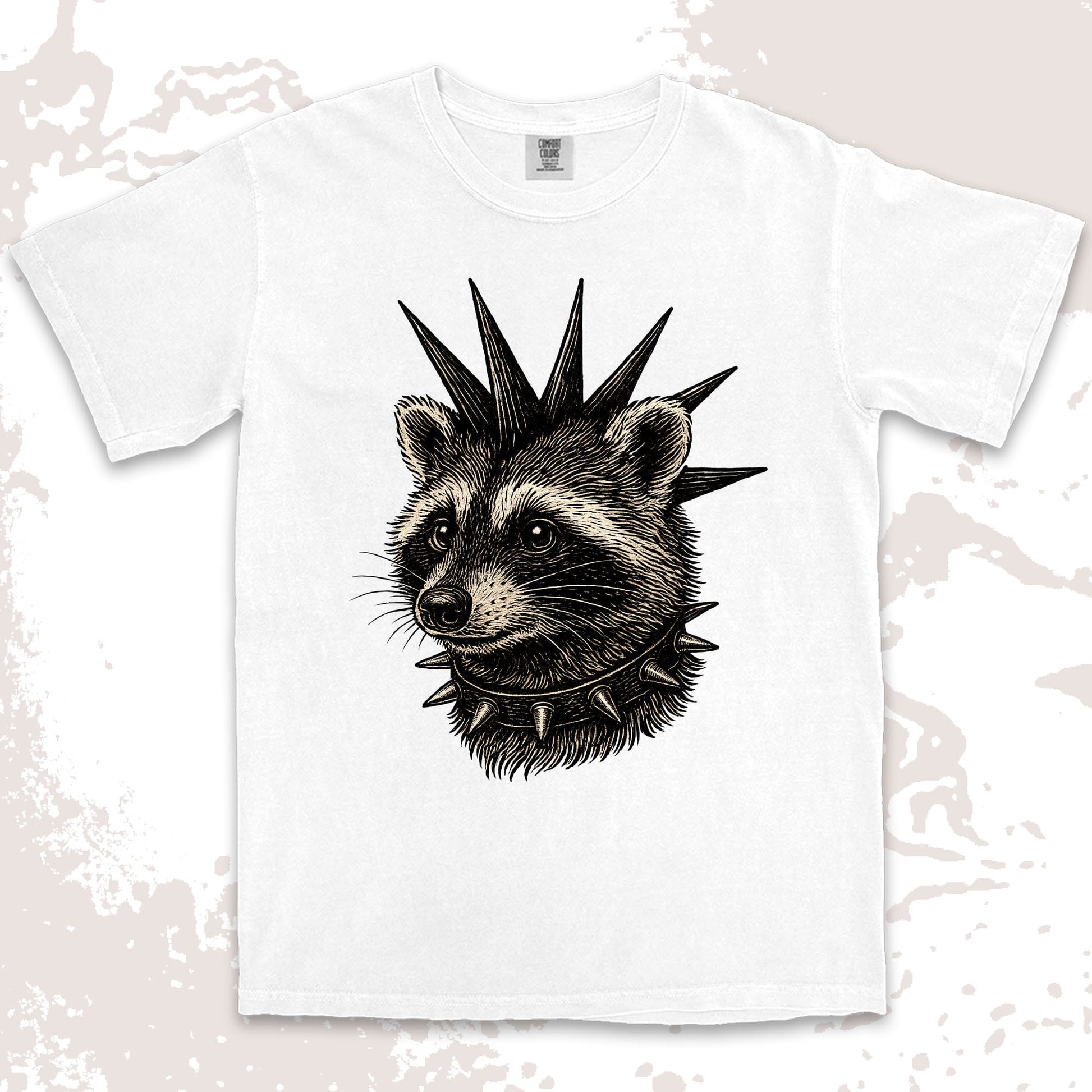 White t-shirt with a punk raccoon design wearing a spiked collar on a light background