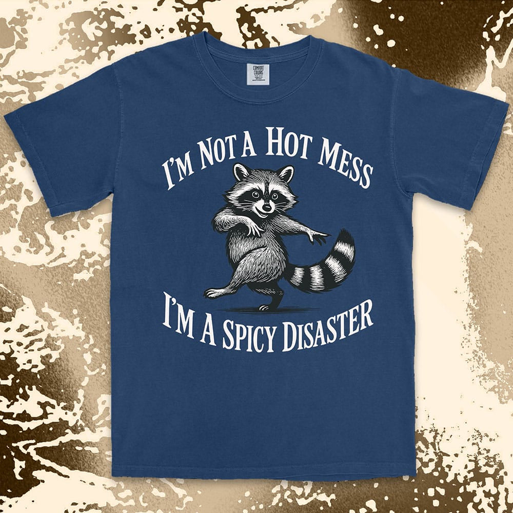 Funny raccoon shirt with dancing raccoon and quote ÒIÕm not a hot mess IÕm a spicy disasterÓ printed on Comfort Color t-shirt.