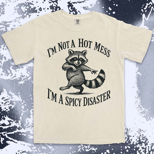 Funny raccoon shirt with dancing raccoon and quote ÒIÕm not a hot mess IÕm a spicy disasterÓ printed on Comfort Color t-shirt.