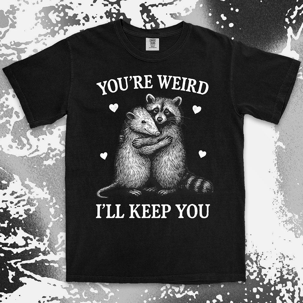 Funny raccoon possum hugging graphic with text You’re Weird I’ll Keep You comfort color t shirt