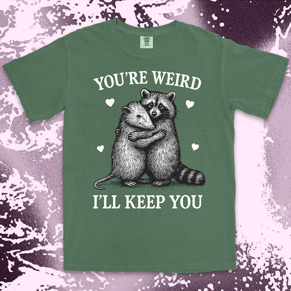 Funny raccoon possum hugging graphic with text You’re Weird I’ll Keep You comfort color t shirt
