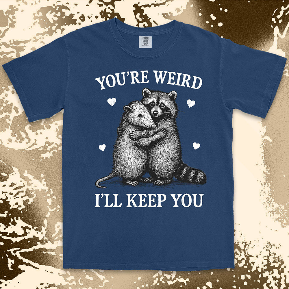 Funny raccoon possum hugging graphic with text You’re Weird I’ll Keep You comfort color t shirt