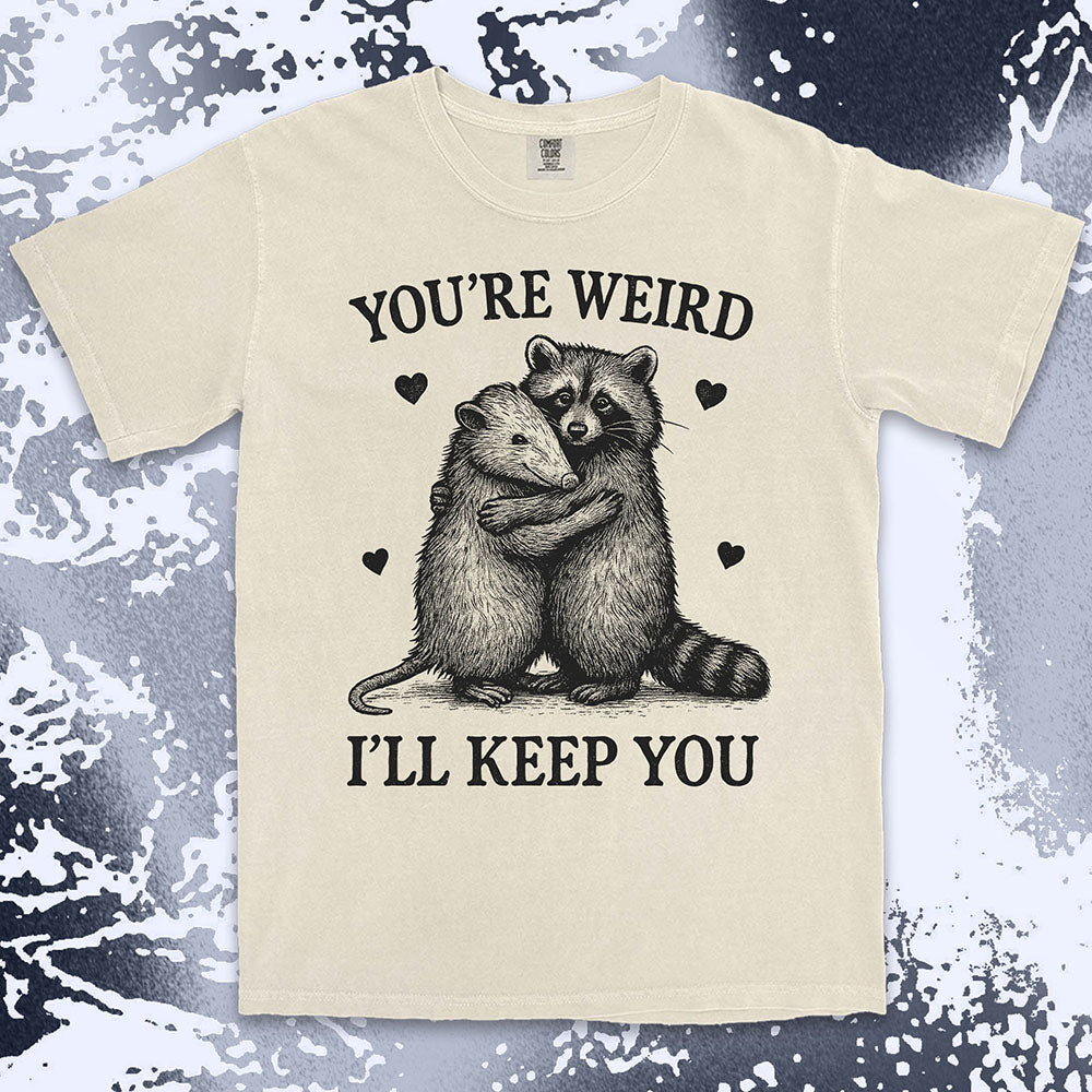 Funny raccoon possum hugging graphic with text You’re Weird I’ll Keep You comfort color t shirt