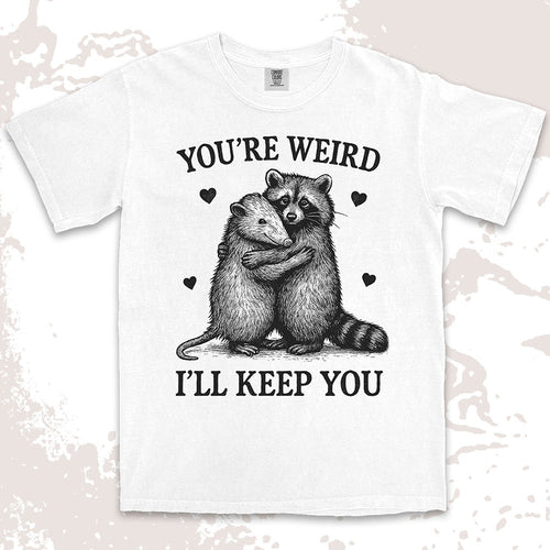 Funny raccoon possum hugging graphic with text You’re Weird I’ll Keep You comfort color t shirt