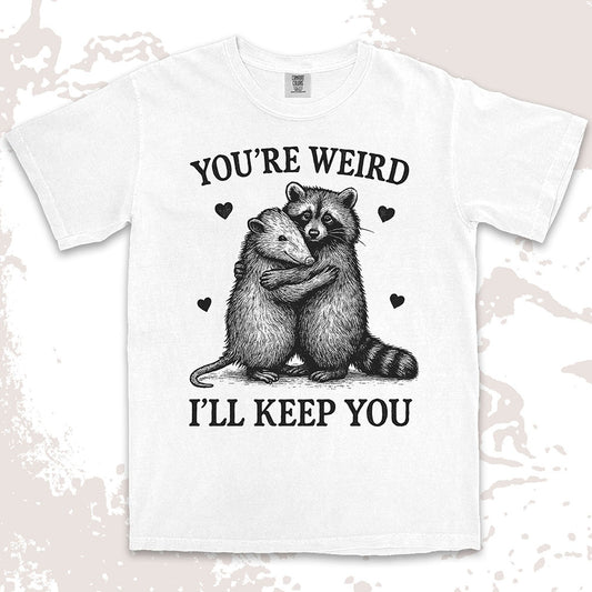 Funny raccoon possum hugging graphic with text You’re Weird I’ll Keep You comfort color t shirt