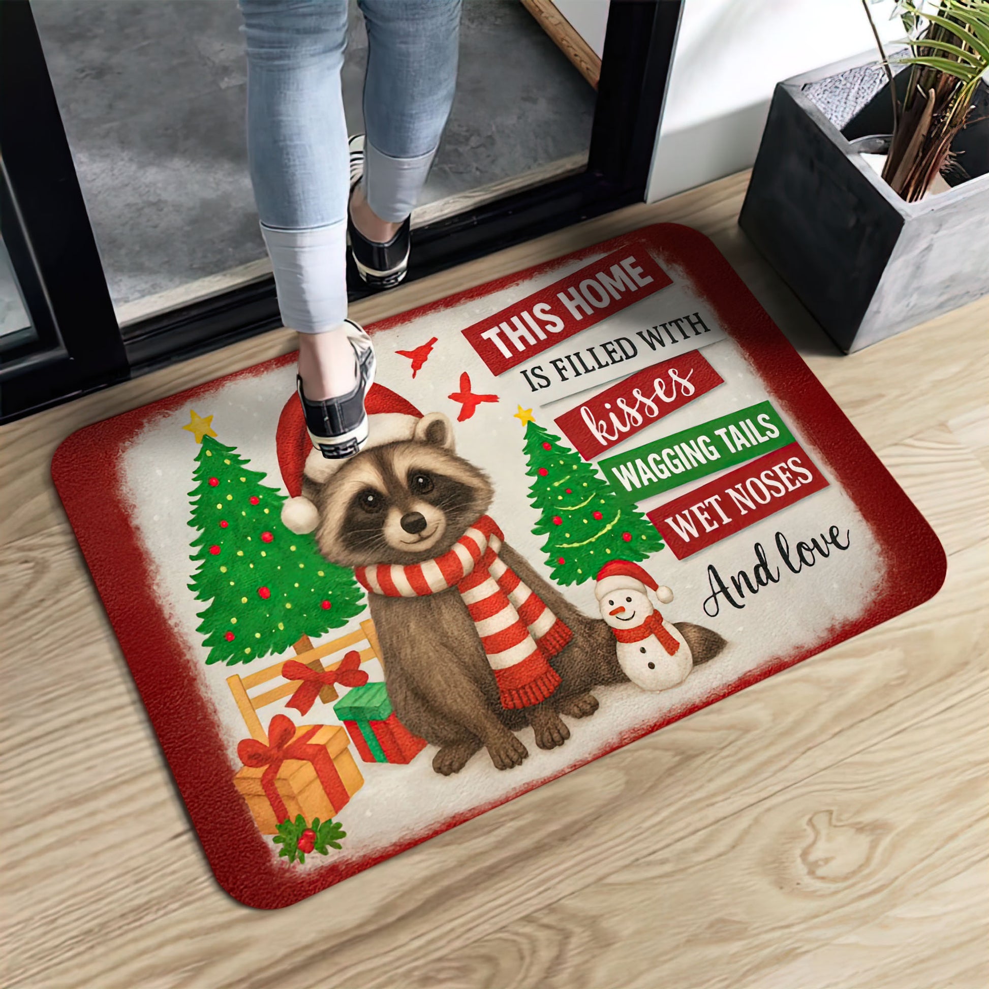 Christmas raccoon doormat with Santa hat, Christmas trees, and quote “This home is filled with kisses, wagging tails, wet noses, and love.”