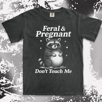 Funny raccoon shirt with “Feral & Pregnant Don’t Touch Me” quote, bold humor maternity design