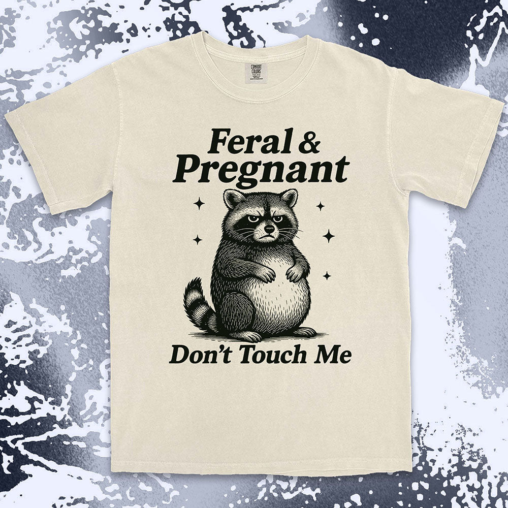 Funny raccoon shirt with “Feral & Pregnant Don’t Touch Me” quote, bold humor maternity design
