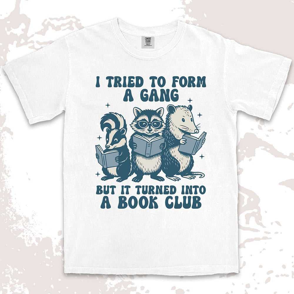 Comfort Color t-shirt with raccoon, skunk, and possum reading books and quote “I tried to form a gang but it turned into a book club.”