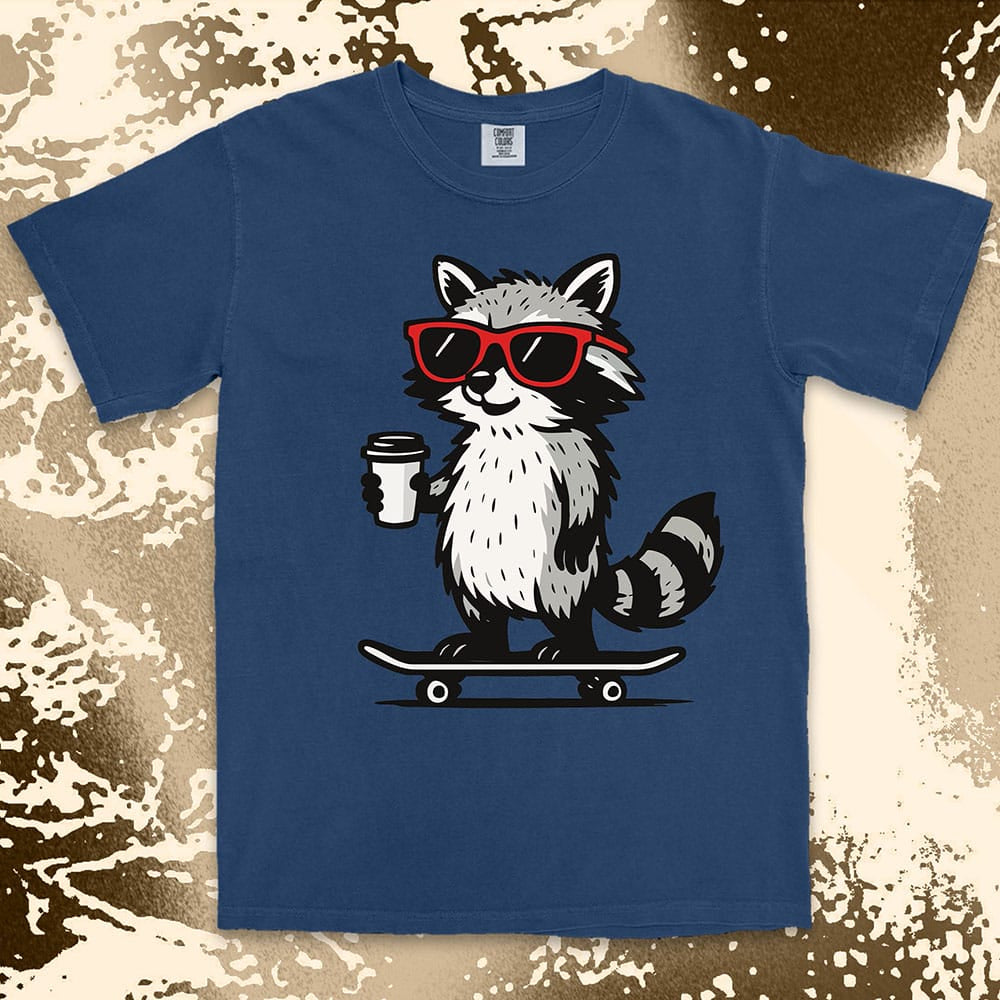 Raccoon with skateboard and coffee, wearing red sunglasses, cool skater raccoon design on Comfort Color t-shirt.