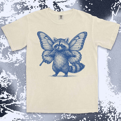Comfort Color t-shirt with raccoon illustration featuring big butterfly wings in a magical fairy style.