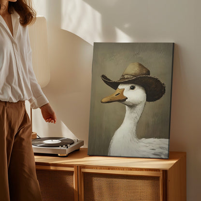 Cowboy duck canvas wall art featuring a white duck wearing a vintage brown cowboy hat in rustic farmhouse style