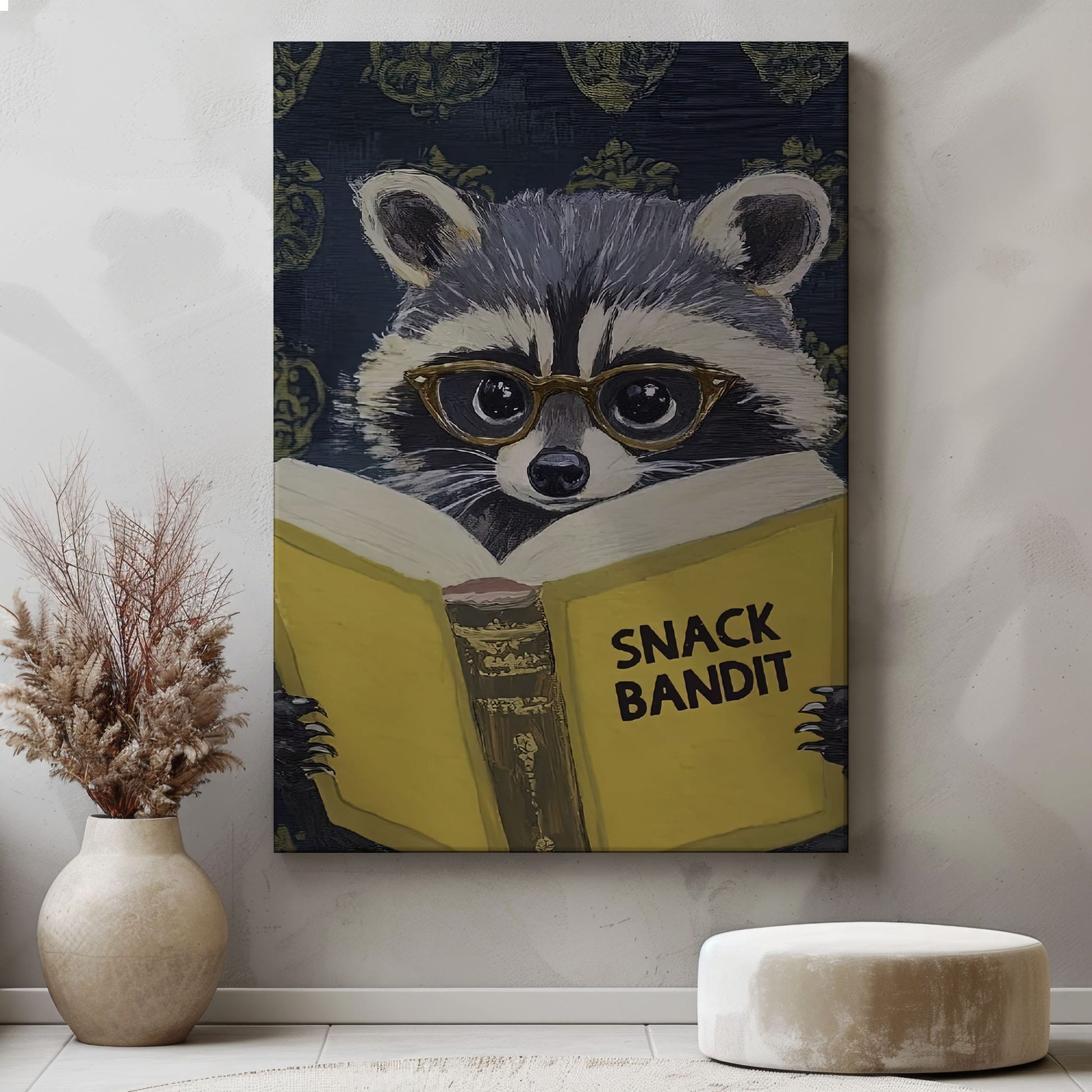 Snack Bandit raccoon canvas wall art featuring a raccoon wearing glasses reading a yellow book in vintage playful style