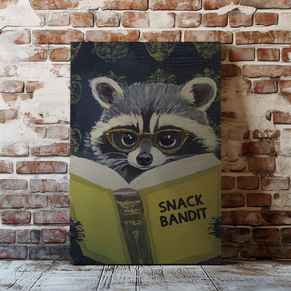 Snack Bandit raccoon canvas wall art featuring a raccoon wearing glasses reading a yellow book in vintage playful style