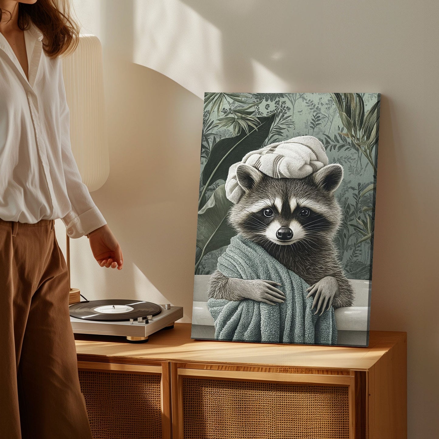 Spa raccoon canvas wall art featuring a raccoon wrapped in a green towel with a towel turban against leafy vintage background