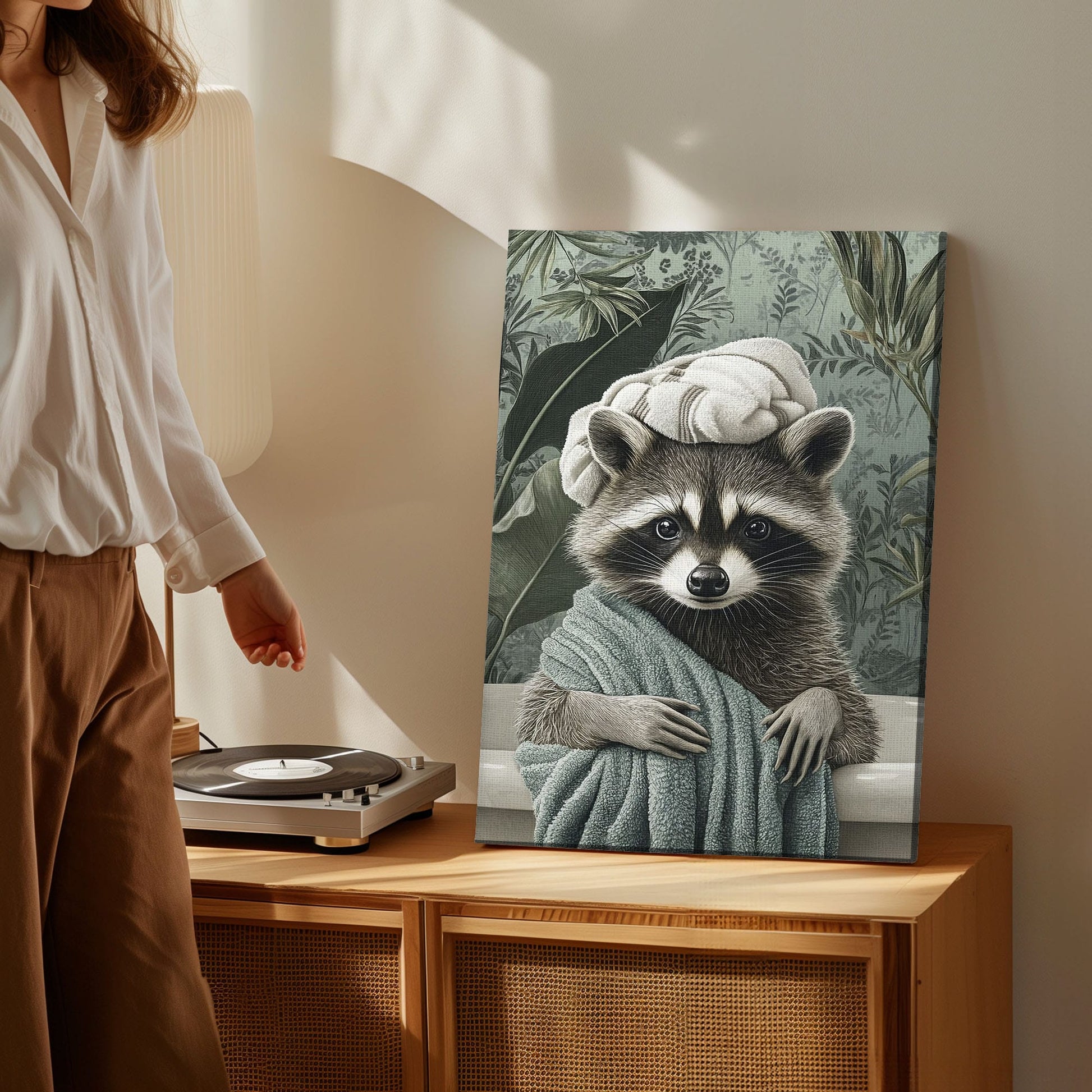 Spa raccoon canvas wall art featuring a raccoon wrapped in a green towel with a towel turban against leafy vintage background