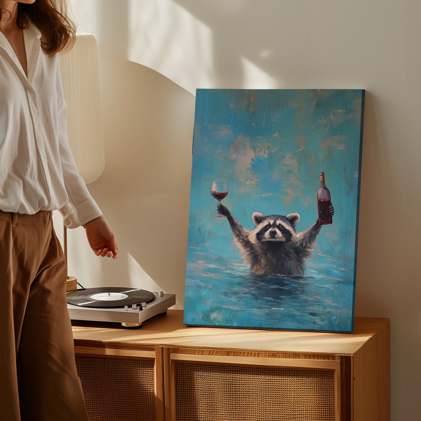 Wine lover raccoon canvas wall art featuring a raccoon in water holding a wine bottle and glass in bright blue impressionist style
