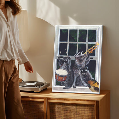 Raccoon band canvas wall art featuring three raccoons playing drum, trumpet, and guitar near a window in humorous vintage style