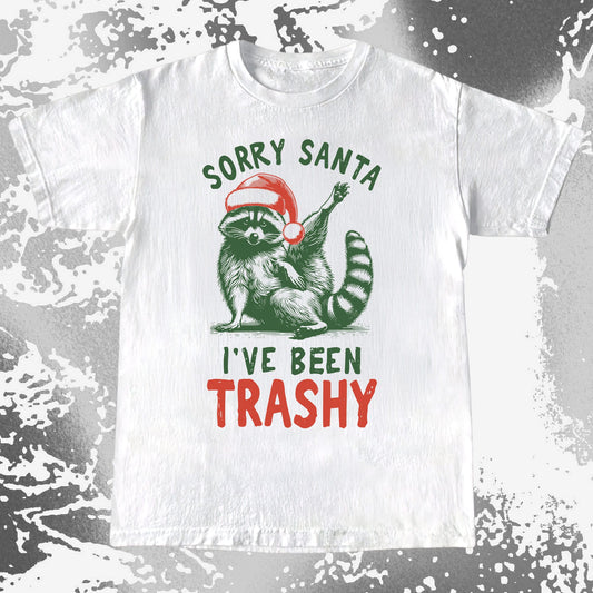 Funny “Sorry Santa I’ve Been Trashy” raccoon Christmas shirt with raccoon in Santa hat raising paw