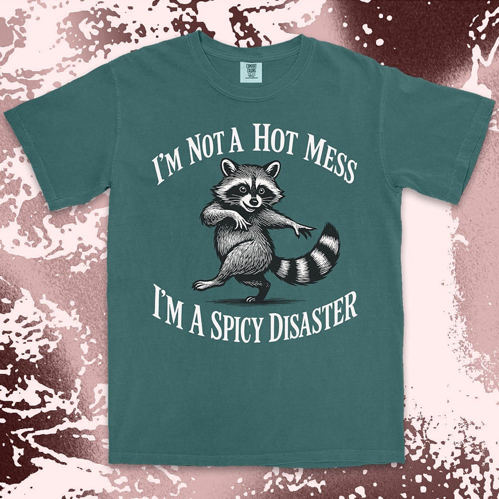 Funny raccoon shirt with dancing raccoon and quote ÒIÕm not a hot mess IÕm a spicy disasterÓ printed on Comfort Color t-shirt.